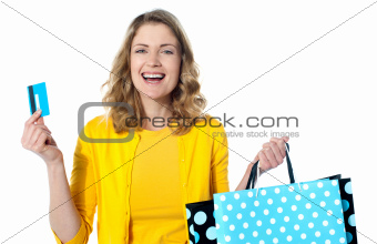 Happy shopaholic female laughing