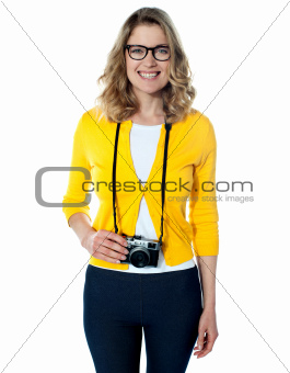 Attractive young girl with a camera