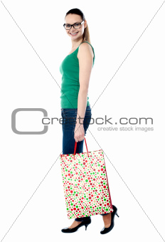Beautiful shopping woman happy holding shopping bags