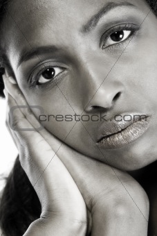 Dark female model resting on her hands