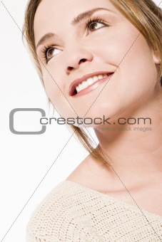 young woman looking up smiling