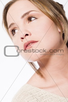 young woman looking up thinking