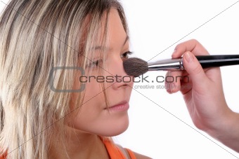 Young girl does make-up
