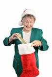 Senior Opens Christmas Stocking