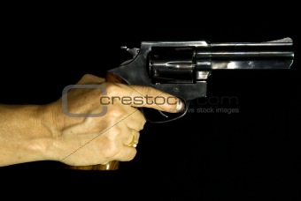 Female Hand Holding a Revolver