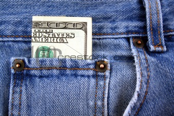 One hundred dollar bill in jeans pocket