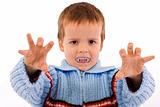 Boy with fake vampire teeth
