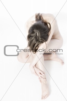 Folded naked woman