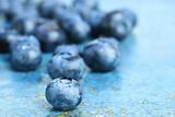 Blueberries on blue background