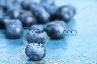Blueberries on blue background