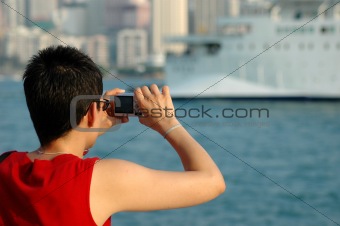 Lady taking picture with a digital camera