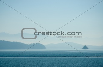 Body of water with haze from a forest fire