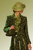 Green coat and a hat