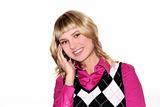 Young blond woman is calling by mobile phone