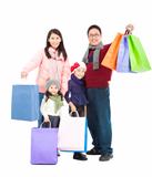 happy asian family with shopping bag in winter clothing