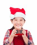 smiling little girl holding christmas gift