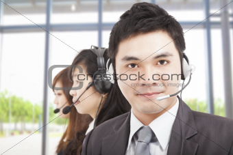 smart asian businessman with call center agent