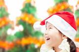 Happy little girl in christmas hat