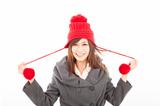  happy young woman wearing winter coat and cap