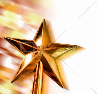 New year golden star in motion on bright bokeh background.jpg