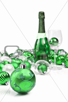 Green christmas ornaments and sparkling wine