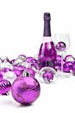 Purple christmas ornaments with sparkling wine