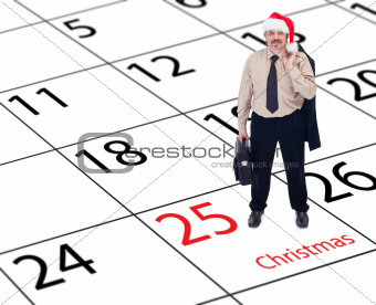 It's finally christmas - businessman standing on calendar