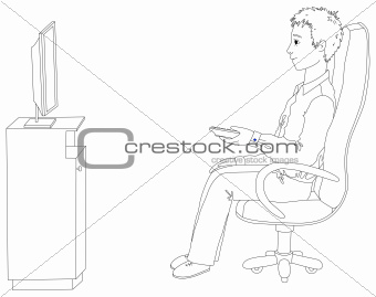 Young man sitting in a chair and watching TV
