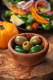 Delicious green olives with salad