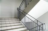 staircase with metallic handrails in modern interior