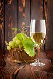 Glass of white wine and grapes