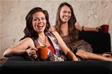 Pair of Laughing Women with Cups