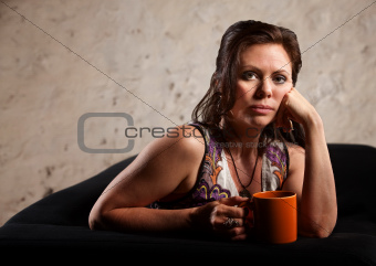 Serious Woman with Hand on Cheek