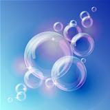 Blue abstract background with transparent bubbles.