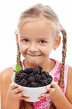 Yummy blackberries - happy healthy girl with fresh fruits