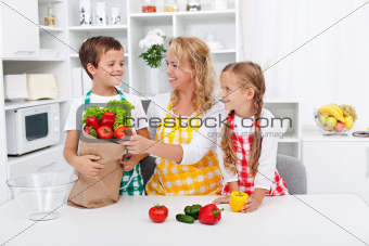 Healthy nutrition concept with people in the kitchen