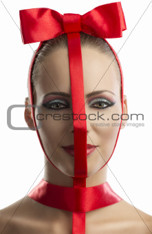 beauty portrait of girl with red bow, is in close-up