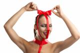 beauty portrait of girl with red bow with hands on the head