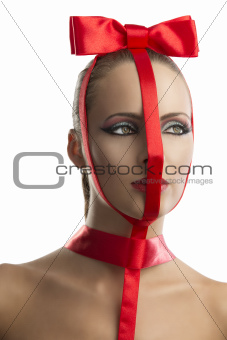 beauty portrait of girl with red bow, looks at left