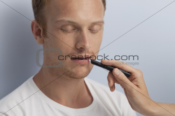 Man's facial cosmetic treatment.