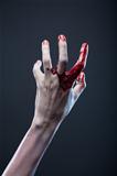 Bloody zombie hand, extreme body-art 