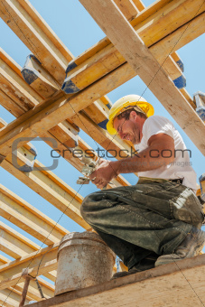 Smiling construction worker busy under slab formwork beams