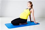 Pregnant woman stretching and relaxing
