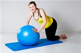 Pregnant woman doing push-up exercise