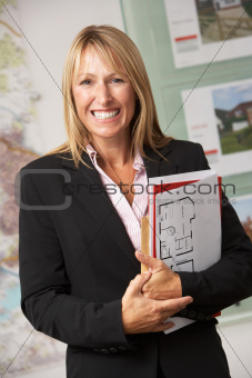 Portrait Of Female Estate Agent In Office