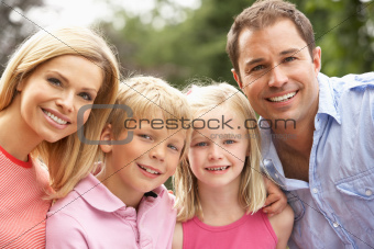 Portrait Of Family Relaxing In Countryside