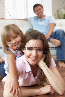 Portrait Of Happy Family Relaxing At Home