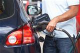 Detail Of Male Motorist Filling Car With Diesel At Petrol Station