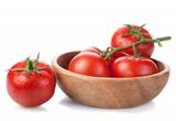 brush tomatoes in a wooden bowl isolated on white background