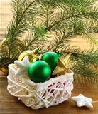 box of Christmas toys and decorations on wooden background
